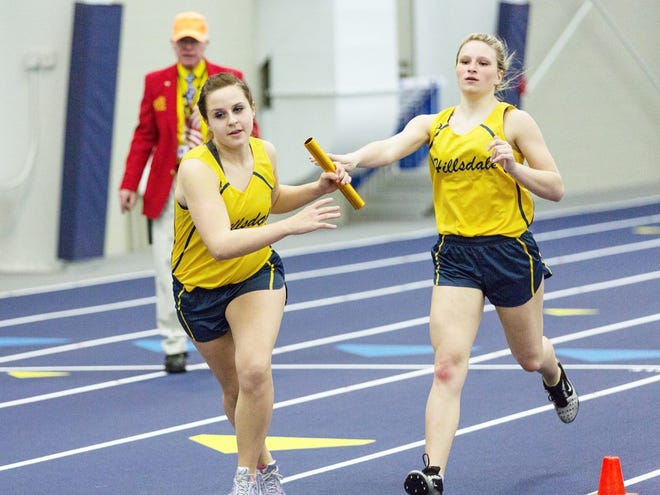 Hillsdale's Kasey Caulkins receives the baton exchange from fellow teammate McKenna Thayer during a meet earlier this season. On Tuesday, the Hornets defeated Brooklyn Columbia Central 92-44. Jim Drews photo