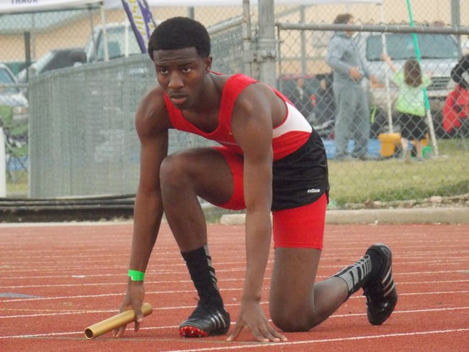 DHS sprinter Anthony Jackson gets ready to start the race of the 800-meter relay at a meet earlier this season.