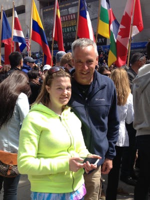 Nancy Weber's daughter Rachael and husband Kevin pose at the finish line of the 117th Boston marathon on Monday, April 15. It was day they will all remember.