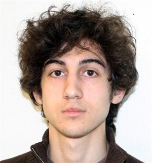 This photo released Friday, April 19, 2013, by the Federal Bureau of Investigation shows a suspect that officials identified as Dzhokhar Tsarnaev, being sought by police in the Boston Marathon bombings Monday.