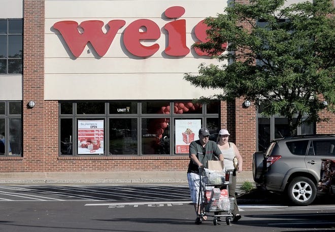 (FILE PHOTO) Shoppers head back to their car after shopping at Weis Markets in Doylestown. Bedminster planners are looking over a proposal for another Weis Markets location in Central Bucks County.