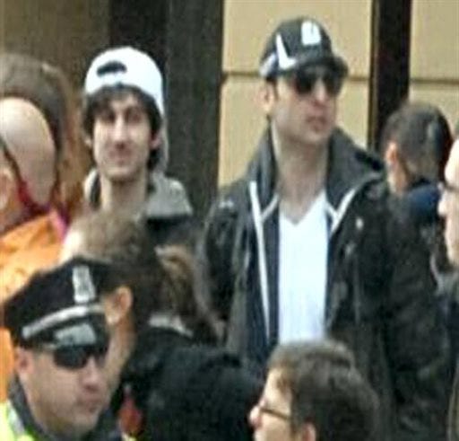 This photo released by the FBI early Friday April 19, 2013, shows what the FBI is calling the suspects together, walking through the crowd in Boston on Monday, April 15, 2013, before the explosions at the Boston Marathon. (AP Photo/FBI)