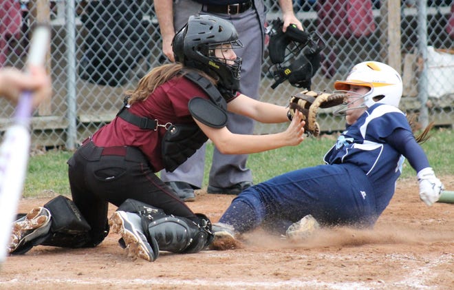 Pike/Democrat photo



STA’s Skylar Labbe, right, scores the winning run as Portsmouth catcher Maddy Ovadek awaits the throw during Friday’s Division II game in Dover.
