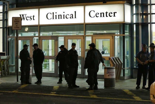 Police stand guard outside Beth Israel Deaconess Medical Center Friday, April 19, 2013 after an ambulance carrying Dzhokhar Tsarnaev, a19-year-old Massachusetts college student wanted in the Boston Marathon bombings, arrived. Tsarnaev is hospitalized in serious condition with unspecified injuries after he was captured in an all day manhunt. (AP Photo/Elise Amendola)