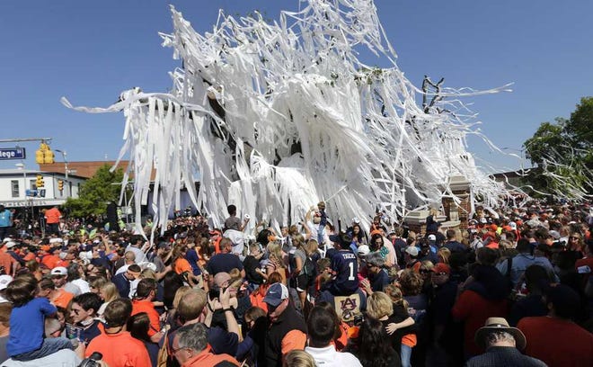 Fans roll the poisoned oak trees at Toomer's Corner one final time following Auburn's A-Day spring game on Saturday.