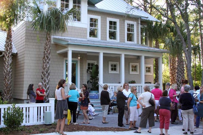 Photos by Maggie.FitzRoy@jacksonville.com Volunteers line up for an April 10 training session at the HGTV Smart House in Jacksonville Beach. Tours began April 12, and about 600 people toured the house during the first weekend. At least 900 are expected to tour it today and tomorrow.