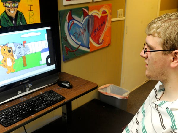 Zachary Noah watches one of his animated creations on a computer, Wednesday in Gadsden. Noah, who has a form of Autism, will be teaching drawing classes at My Masterpiece Art Studio and Gallery.