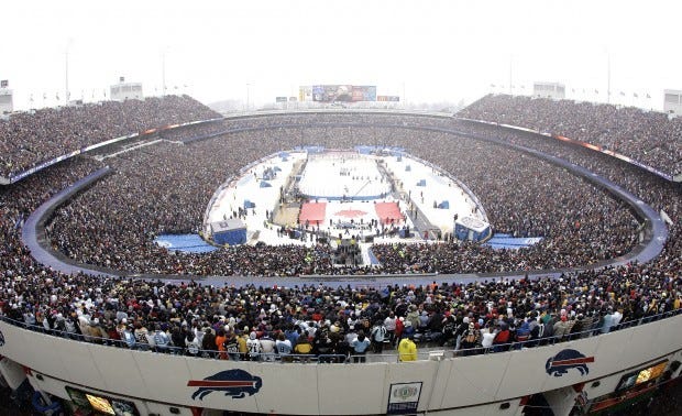 Buffalo Sabres and Pittsburgh Penguins stand for the national anthem at the start of the NHL Winter Classic outdoor hockey game at Ralph Wilson Stadium in Orchard Park, N.Y., Tuesday, Jan. 1, 2008. (AP Photo/David Duprey)