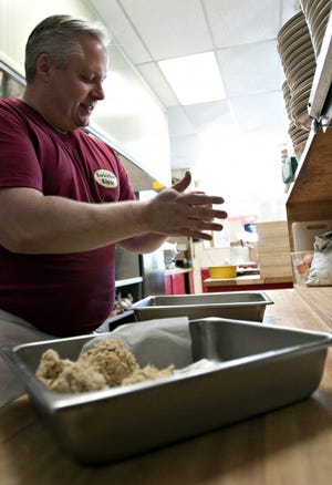 Lobster Claw owner Jim Rope prepares his famous crab cakes Wednesday at The Lobster Claw, a seafood market on Easton Road in Plumstead. The restaurant is celebrating its 25th anniversary this year. It's an unusual restaurant for the area.