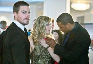 Stephen Amell, Emily Bett Rickards and David Ramsey | Photo Credits: Cate Cameron/The CW