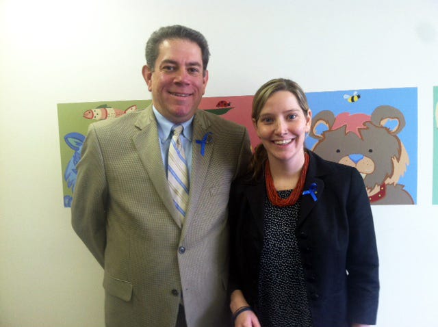 James Ritts, Ontario County assistant district attorney and advisory committee chairperson for the Child Advocacy Center of the Finger Lakes, and Skye Peebles, the center's program director, wear blue ribbons — the symbol of child abuse prevention — in recognition of National Child Abuse Prevention Month. The center has distributed ribbons to numerous locations in Ontario County and encourages community members to wear them throughout the month.