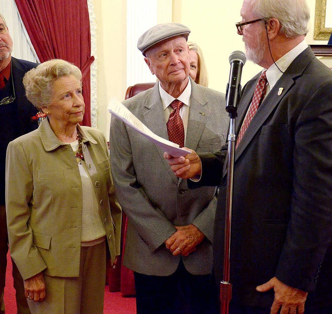 Herbie Wiles and his wife Annette listen as St. Augustine Mayor Joe Boles reads a proclamation awarding him the Order of la Florida, St. Augustine's highest and most prestigious award, at a city commission meeting in The Alcazar Room of City Hall on Monday, April 22, 2013. By PETER WILLOTT, peter.willott@staugustine.com