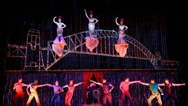 (Top, from left) Emily Afton, Brit West and Bre Jackson and company in the ‘Priscilla’ number ‘It’s Raining Men.’ Photo by Joan Marcus