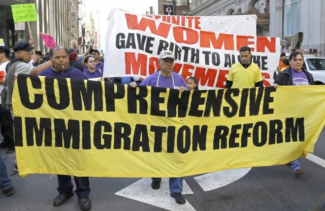 FILE - In this April 10, 2013, file photo, immigration reform supporters march in the downtown area in San Francisco. There's nearly unanimous, bipartisan agreement that the nation's immigration laws need fixing more than a quarter-century after the last major overhaul. Some 11 million immigrants live illegally in the U.S., most with no prospect of ever legalizing their status under current law _ unless they return to their home countries for 10 years first. (AP Photo/Ben Margot, File)