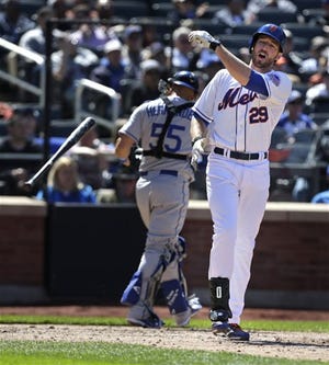 Mets' Ike Davis throws his bat after striking out during the sixth inning against the Los Angeles Dodgers at Citi Field Thursday, April 25, 2013, in New York.