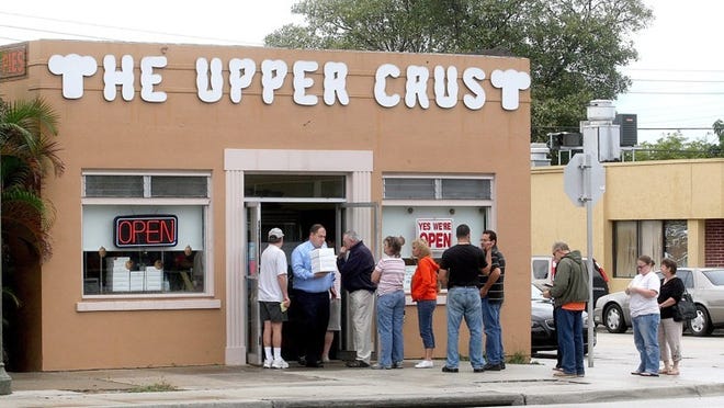 Each year, The Upper Crust bakery in Lake Worth attracts lines of people who have ordered pies for their Thanksgiving dinners. The company offers as many as 34 different kinds, including meringue pies, fruit pies, cream pies and specialties, such as no-sugar-added apple and French California strawberry. Damon Higgins/Palm Beach Post file photo