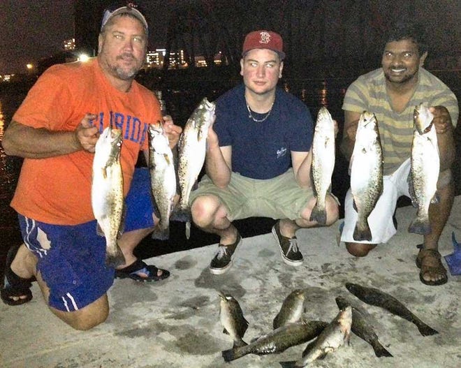 Photos by Bob.McNally For the Times-Union Anglers Jimmy and Cody Sharpe (from left), and Arun Ramalingam show part of an evening catch of spotted sea trout made in downtown Jacksonville.