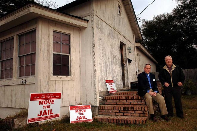 Bob Torras Sr. (right), with Jeff Killgore, bought this house as part of an effort to stop jail expansion. Now he's asked to help find a new use for the old jail.