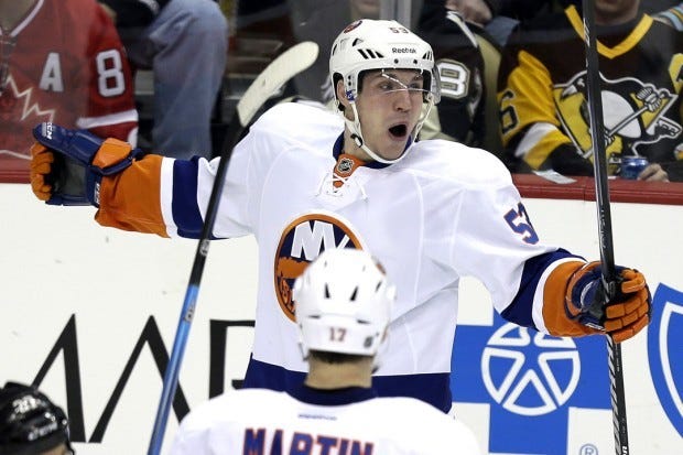 New York Islanders center Casey Cizikas (53) celebrates his goal during the first period of an NHL hockey game against the Pittsburgh Penguins in Pittsburgh on Tuesday, Jan. 29, 2013. (AP Photo/Gene J. Puskar)