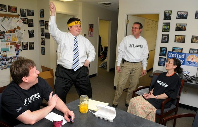 Jamie Haddon, new CEO of the United Way of Bucks County, demonstrates a dance during a staff meeting on Thursday morning in the Fairless Hills office. Several staff members will perform during the upcoming pep rally. Also pictured are (from left to right) Dan Warvolis, accountant; John Ramirez CFO; and Patty Smallacombe, senior vice president of community impact. Under the leadership of Haddon, the United Way of Bucks County is trying to reinvent itself and the way it interacts with the community.