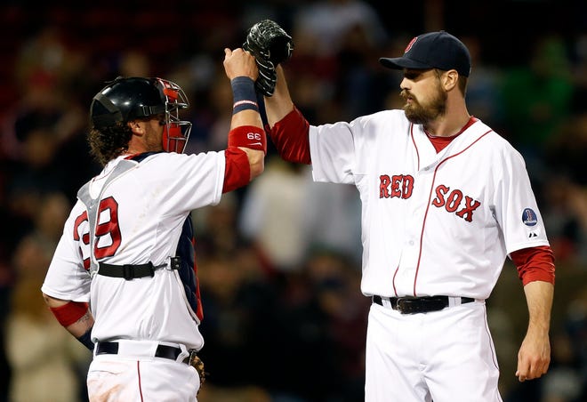 Jarrod Saltalamacchia (left) and Andrew Miller celebrate the Red Sox' win over the Astros on Saturday night.