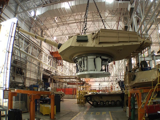 This undated file photo provided by the General Dynamics Land System shows the production of an Abrams tank in Lima, Ohio. (AP Photo/General Dynamics Land System, File)