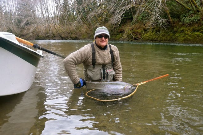 Jeff Cutter courtesy photo

RiverWorks' Jeff Cutter with a steelhead trout he's about to release in Washington State.