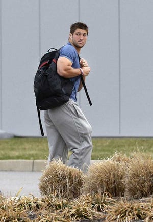 Mel Evans Associated Press Quarterback Tim Tebow arrives on the first day of NFL offseason workouts at the Jets practice facility in Florham Park, N.J., on April 15.