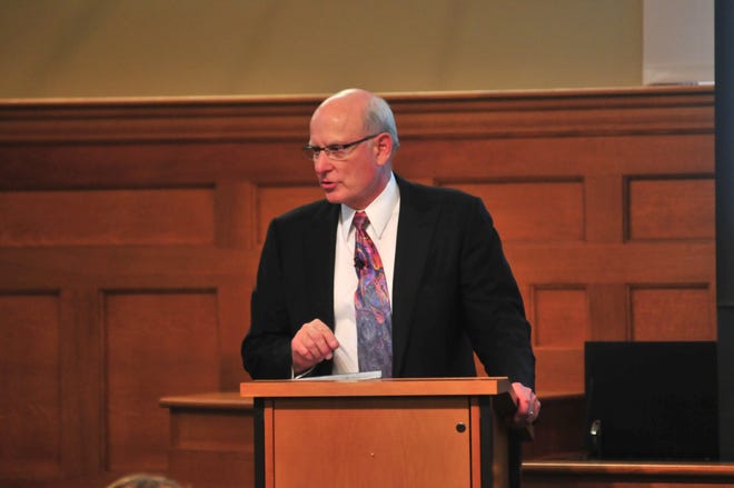Dick Haworth, chairman emeritus of Holland-based Haworth Inc., gives a lecture to a full house at Graves Hall Tuesday night.
