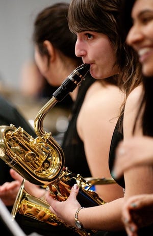 The Cavalcade of Bands Jazz Championships hosted by the Bensalem High School music department on Friday night. Here Bensalem baritone saxophone player Maria Raggousis improvs in the warmup room with her bandmates before the competition.