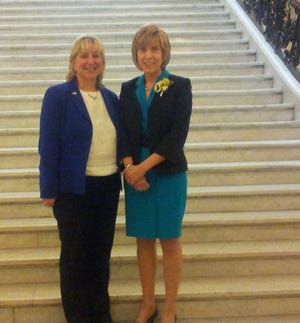 Sen. Karen Spilka and Susan Nicholl on the steps of the grand staircase at the State House earlier today.
