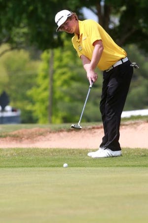 Crest's Isaac Powell puts at Monday's final Big South 3A Conference golf match.