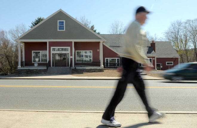 Stan Knox of Sturbridge walks past the former Basketville building at 419 Main St. in Sturbridge. The building has been renovated for dental office and restaurant space.