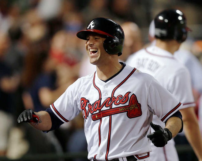 Atlanta pitcher Tim Hudson celebrates his fifth-inning home run against the Washington Nationals on Tuesday.