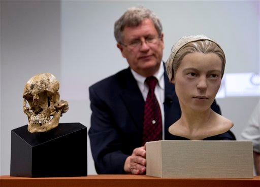 Doug Owsley, division head for Physical Anthropology at the Smithsonian's National Museum of Natural History, displays the skull and facial reconstruction of "Jane of Jamestown" during a news conference at the museum in Washington, Wednesday, May 1, 2013.