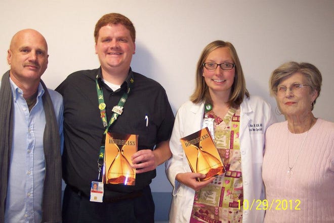 Don Greene (far left) stands with palliative staff from Charles George VA Medical Center in Asheville and his mom Joy Greene (far right).