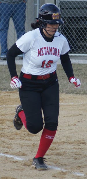 Erica Phillips charges to first for the Redbirds in a recent game.