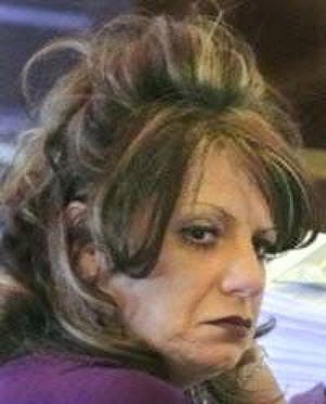 Gina Clark of Marstons Mills and her defunct charity, Touched by Angels, were indicted in March 2011 on a combined 60 counts of embezzlement and state wage violations.