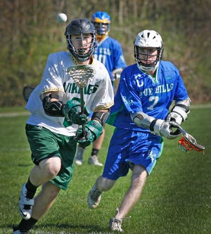 South Shore Votech's CJ Graziano, left, has his eyes on a loose ball as does Blue Hills Regional's Billy O'Meara during a lacrosse game in Hanover, Wednesday, May 1, 2013.