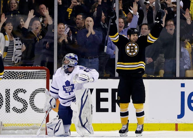 Boston Bruins right wing Nathan Horton, right, celebrates his goal against Toronto Maple Leafs goalie James Reimer in the first period in Game 1 of a first-round NHL playoff series in Boston, Wednesday, May 1, 2013.