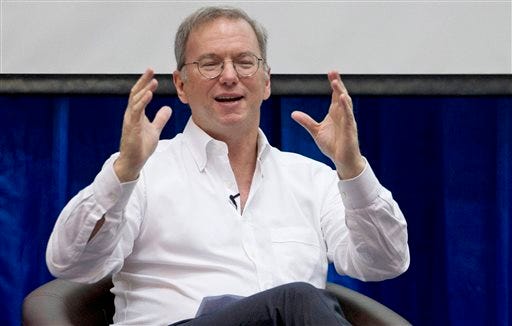 FILE - In this Friday, March 22, 2013, Google Executive Chairman Eric Schmidt gestures during an interactive session with group of students at a technical university in Yangon, Myanmar . Schmidt said "the future is now" for YouTube, which recently passed the milestone of 1 billion unique visitors every month. But, he added with the Third World in mind, if you think that's a large number, "wait until you get to 6 (billion) or 7 billion." (AP Photo/Gemunu Amarasinghe, file)