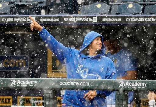 Kansas City Royals pitcher Luis Mendoza gestures in the dugout as snow falls during a weather delay Thursday afternoon at Kauffman Stadium. The Royals and the Tampa Bay Rays played through rain and sleet into the fourth inning before the game was called with Kansas City leading 1-0.