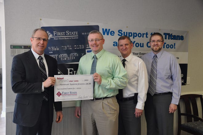 District 238 Superintendent Ed Fletcher accepts a check from First State Bank.