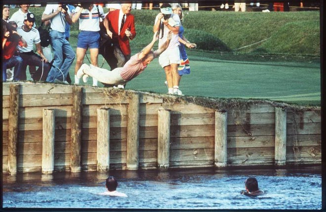 Times-Union file Jerry Pate dives into the water off the 18th green after winning the Players Championship in March of 1982, the first year it was played at the TPC Sawgrass Players Stadium Course. Pate first threw in PGA Tour Commissioner Deane Beman (right) and course architect Pete Dye (left) into the water before diving in himself.
