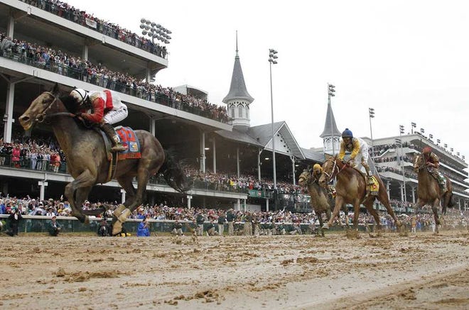 David Coyle Lexington Herald-Leader  Orb, with Joel Rosario up, captures the 139th running of the Kentucky Derby on a sloppy track at Churchill Downs in Louisville, Ky., on Saturday.