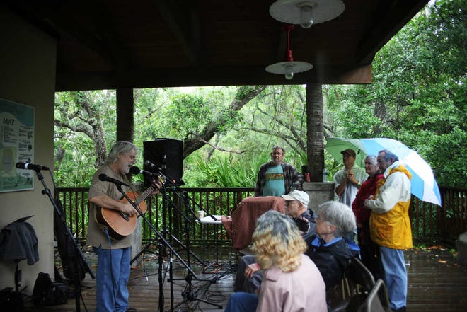 Bill Perras performs on the Gazebo stage on Saturday afternoon at the St. Augustine Amphitheatre during the 2013 Gamble Rogers Music Festival. The rain kept the attendance numbers low, but the music continued throughout the day on four stages. The event will continue today beginning at noon at the St. Augustine Beach Pier pavilion, with free admission. By RENEE UNSWORTH, renee.unsworth@staugustine.com