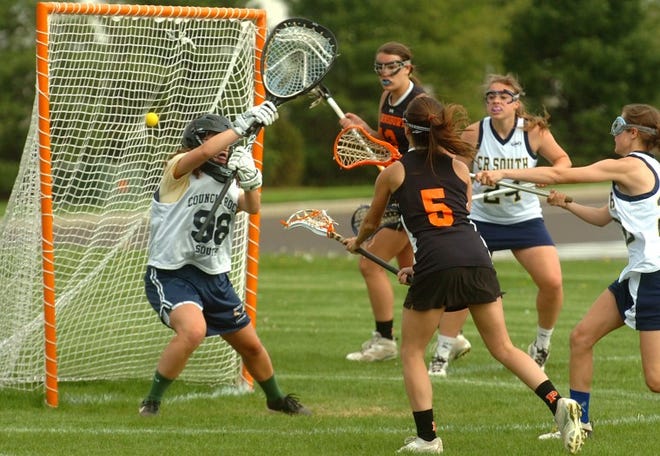 The Pennsbury High School girls lacrosse team beats Council Rock High School South 18-12 in Northampton on Monday afternoon. Here Pennsbury's Kelsy Gumbert scores on South goalkeeper Clare Quist in the second half.