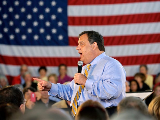 New Jersey Gov. Chris Christie answers a question in this April 30, 2013 file photo taken in Long Beach Township, N.J., during a town hall meeting. Christie secretly underwent gastric band surgery in February to try to lose weight at the urging of his family. (AP Photo/Mel Evans, File)