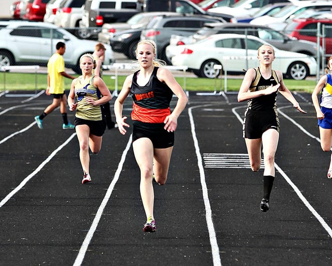 Milledgeville/Eastland's Miranda Grisham sets her sights on the finish line during the preliminaries of the 200-meter dash at the NUIC Girls Track Meet at River Ridge High School Monday.