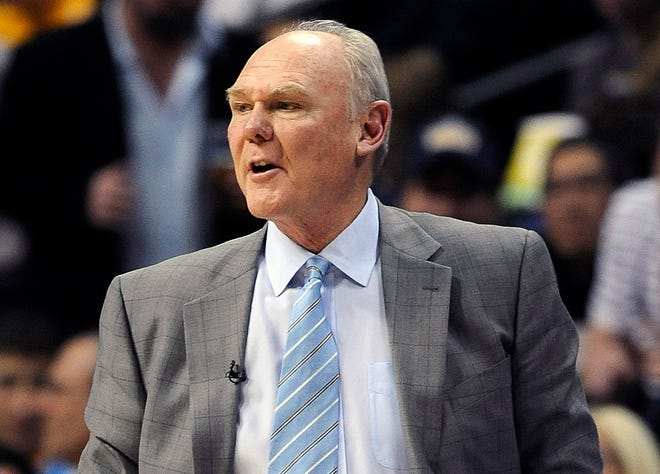 FILE - This April 20, 2013 file photo, Denver Nuggets head coach George Karl looks on in the second quarter of Game 1 in the first round of the NBA basketball playoffs against the Golden State Warriors, in Denver. Karl is the NBA's Coach of the Year after leading the Denver Nuggets to a team-record 57 wins this season. Karl got 62 first-place votes from a panel of sports writers and broadcasters.
